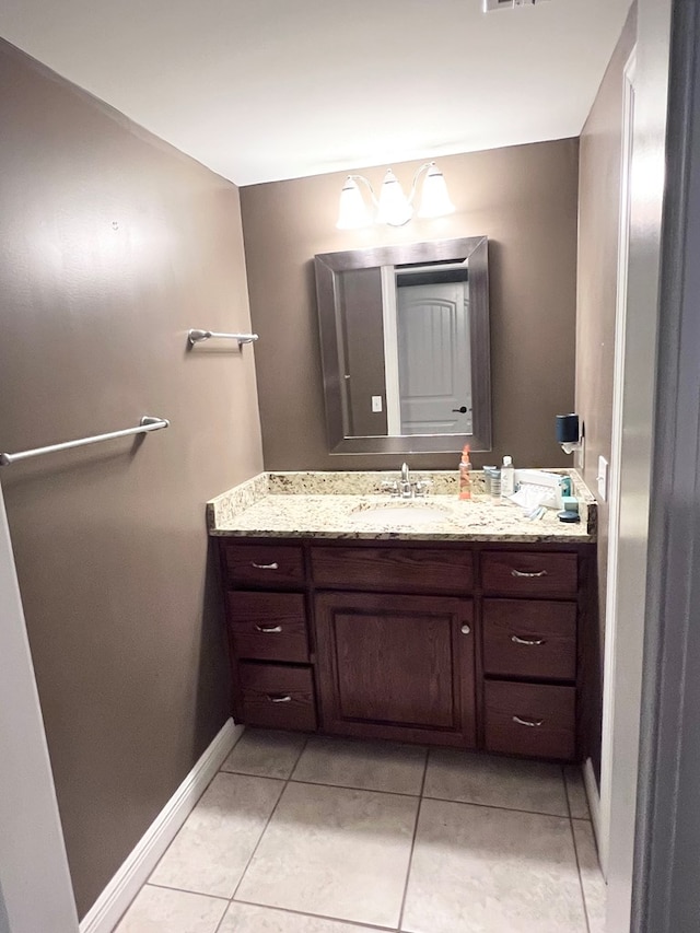 bathroom with tile patterned floors and vanity