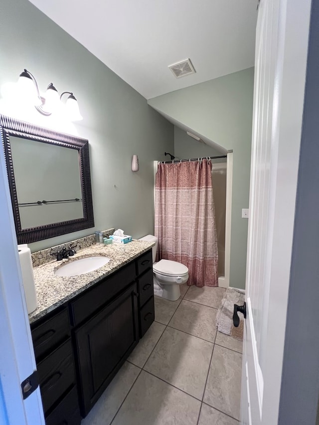 full bathroom featuring tile patterned floors, vanity, shower / bath combination with curtain, and toilet