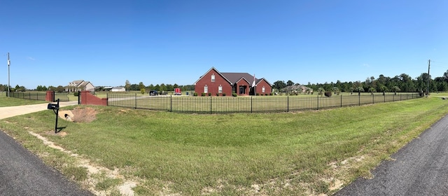 view of yard with a rural view