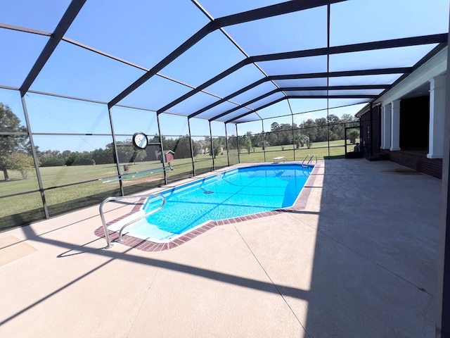 view of swimming pool with a lawn, glass enclosure, and a patio