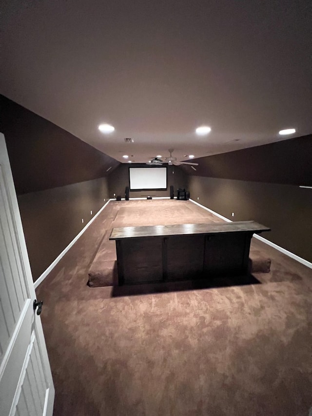 interior space with ceiling fan and vaulted ceiling