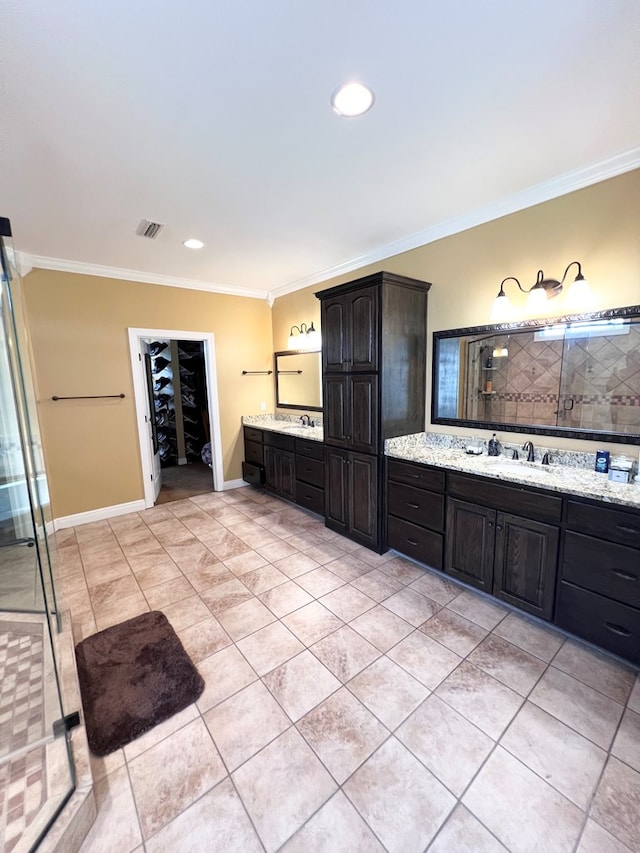 bathroom with tile patterned floors, vanity, an enclosed shower, and ornamental molding