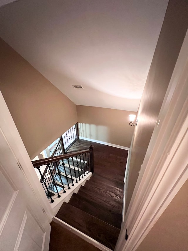 stairway featuring hardwood / wood-style flooring