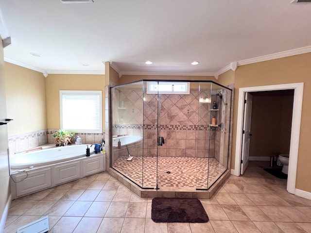 bathroom with separate shower and tub, toilet, and ornamental molding