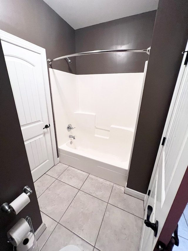 bathroom featuring tile patterned floors and bathtub / shower combination