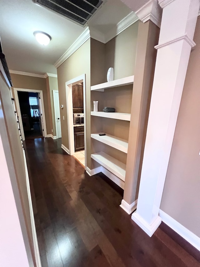 hall featuring wood-type flooring and ornamental molding