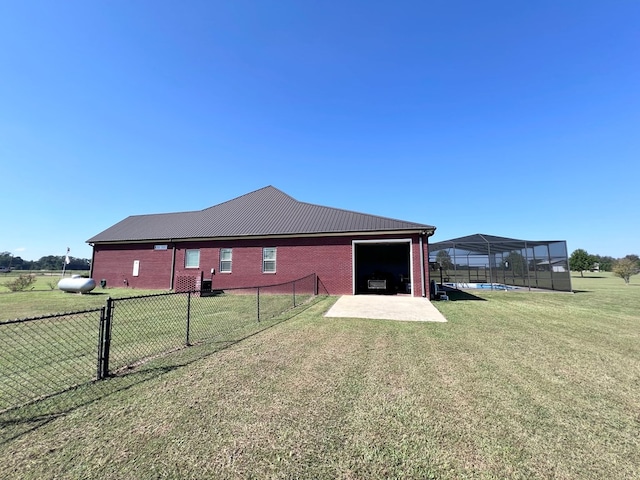 rear view of property with a yard