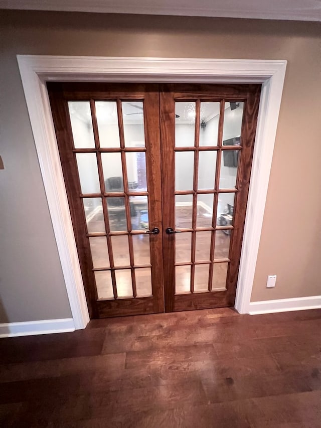 doorway to outside with dark hardwood / wood-style flooring and french doors