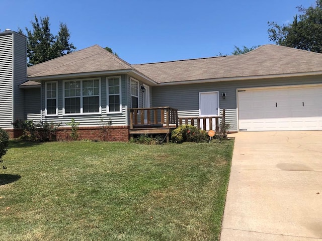 single story home with a front yard and a garage