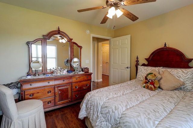 bedroom with dark wood-style flooring and ceiling fan