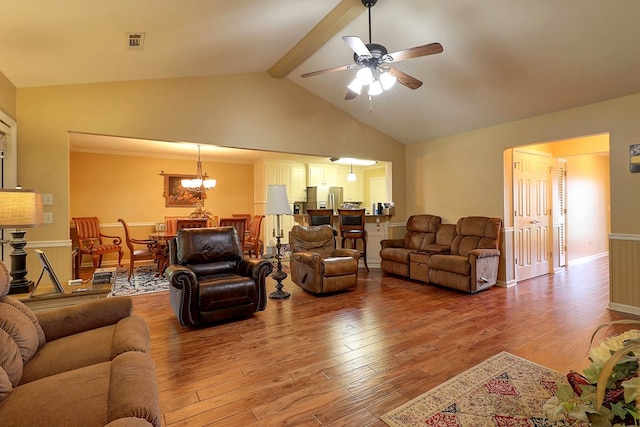living area featuring ceiling fan, wood finished floors, a chandelier, and baseboards