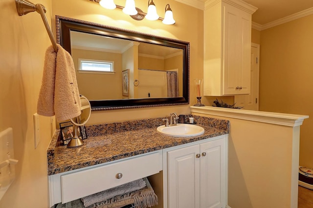 bathroom featuring crown molding, vanity, and curtained shower