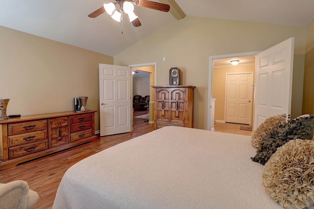 bedroom with beamed ceiling, light wood-type flooring, high vaulted ceiling, a ceiling fan, and baseboards