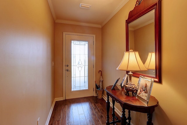 entryway with dark wood finished floors, ornamental molding, and baseboards