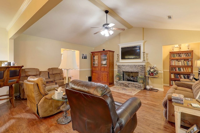 living area featuring ceiling fan, light wood finished floors, a fireplace, and baseboards