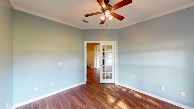 empty room featuring ceiling fan, ornamental molding, dark wood-type flooring, and french doors