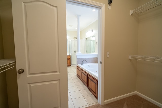 bathroom featuring shower with separate bathtub, tile patterned floors, and ornamental molding