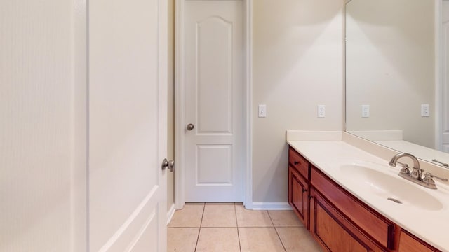 bathroom with tile patterned floors and vanity