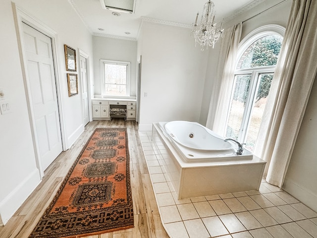 2023 J Saunders Rd, Dothan, AL 36305 - full bath featuring healthy amount of natural light, a jetted tub, ornamental molding, and wood finished floors
