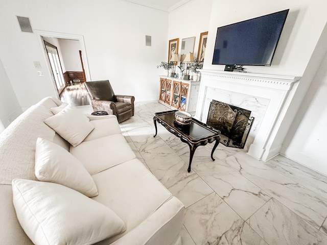 2023 J Saunders Rd, Dothan, AL 36305 - living area with marble finish flooring, a fireplace, baseboards, and ornamental molding