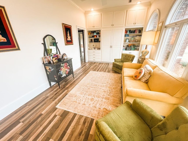 2023 J Saunders Rd, Dothan, AL 36305 - living room featuring baseboards, light wood-style flooring, ornamental molding, and built in features