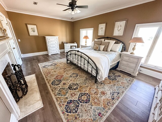 2023 J Saunders Rd, Dothan, AL 36305 - bedroom featuring multiple windows, ornamental molding, dark wood-type flooring, and baseboards