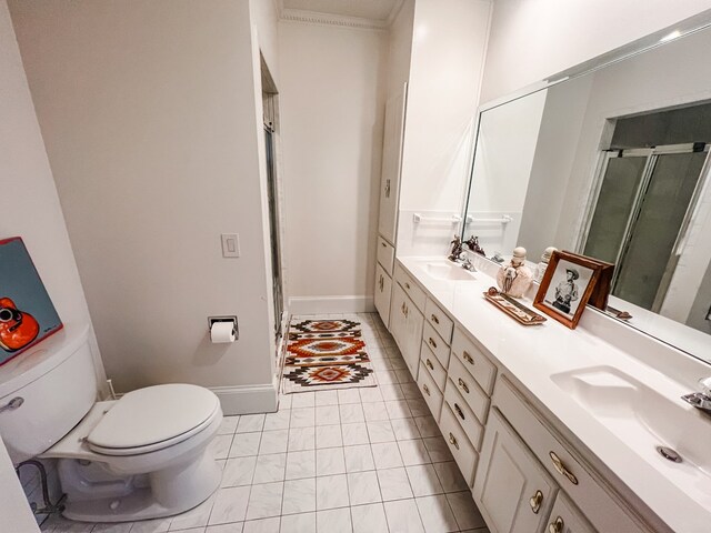 2023 J Saunders Rd, Dothan, AL 36305 - full bath featuring double vanity, a stall shower, toilet, marble look tiles, and baseboards