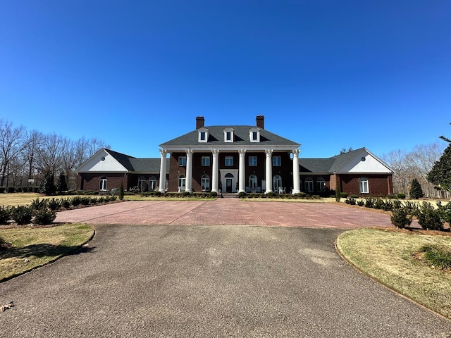 2023 J Saunders Rd, Dothan, AL 36305 - neoclassical home with a chimney, brick siding, and a porch