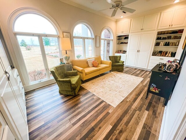 2023 J Saunders Rd, Dothan, AL 36305 - living room featuring wood finished floors, crown molding, a ceiling fan, built in shelves, and recessed lighting
