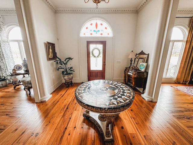 2023 J Saunders Rd, Dothan, AL 36305 - entrance foyer with ornate columns, healthy amount of natural light, light wood-type flooring, and crown molding