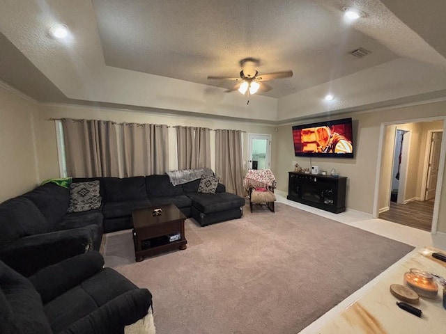112 Vixen Ct, Dothan, AL 36305 - living room featuring a raised ceiling, ceiling fan, carpet flooring, and a textured ceiling