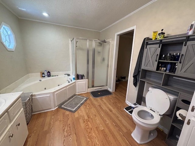 112 Vixen Ct, Dothan, AL 36305 - full bathroom featuring a stall shower, a jetted tub, wood finished floors, a textured ceiling, and ornamental molding