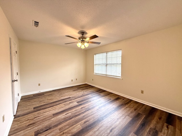 2419 Creekwood Dr, Dothan, AL 36301 - unfurnished room with dark wood finished floors, a textured ceiling, and a ceiling fan