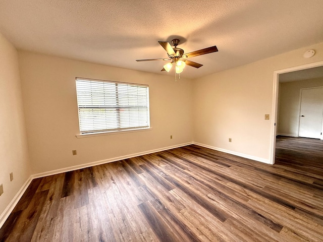 2419 Creekwood Dr, Dothan, AL 36301 - empty room with a ceiling fan, dark wood-style floors, a textured ceiling, and a smoke detector