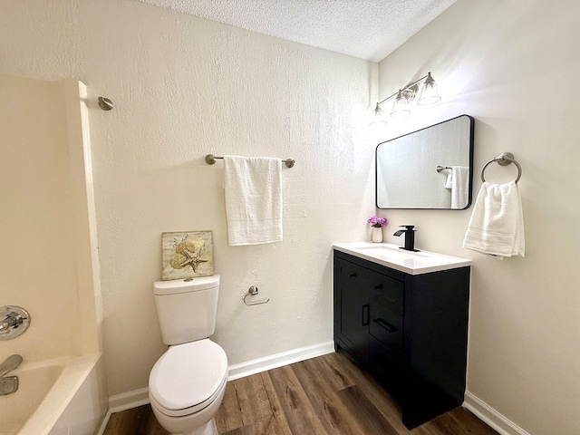 2419 Creekwood Dr, Dothan, AL 36301 - full bath with wood finished floors, vanity, a textured ceiling, and shower / bath combination