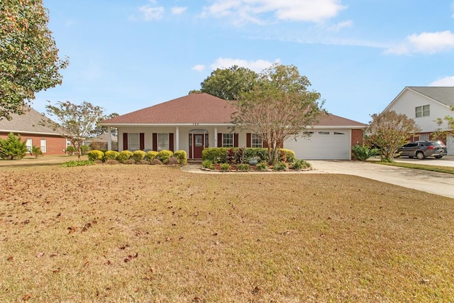 view of front of property featuring covered porch, a garage, and a front yard