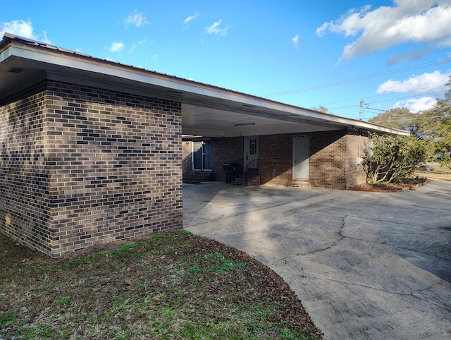 view of home's exterior featuring a carport