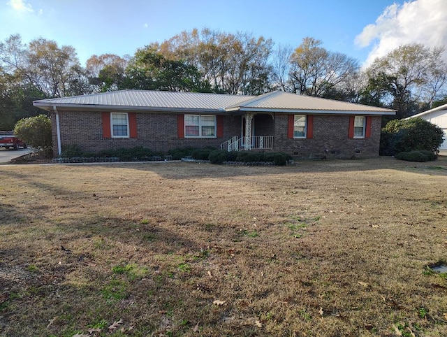 ranch-style home featuring a front yard