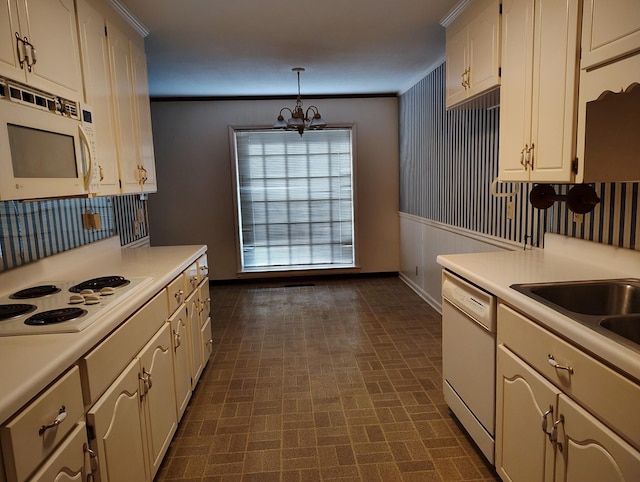 kitchen featuring ornamental molding, decorative light fixtures, white appliances, and a notable chandelier