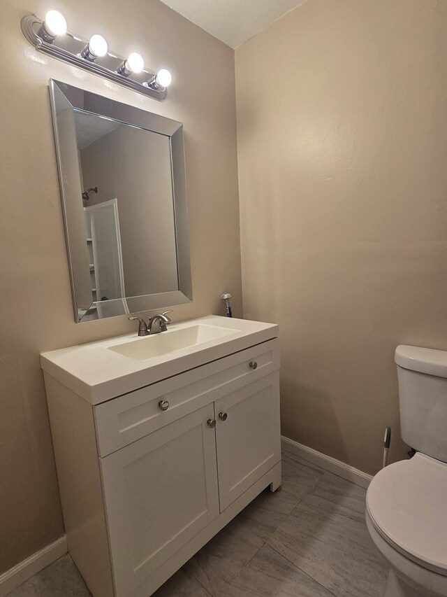 100 Pridmore St, Daleville, AL 36322 - half bath with toilet, vanity, and baseboards