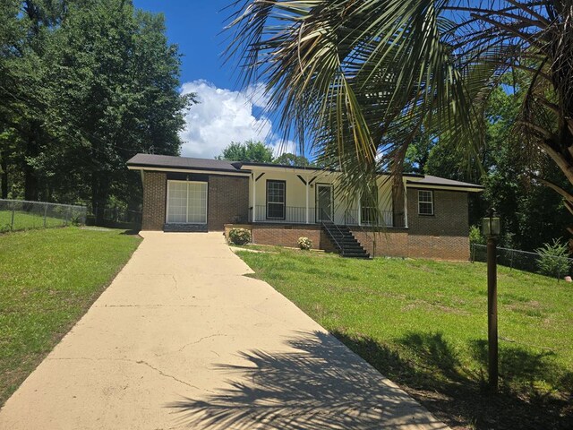 100 Pridmore St, Daleville, AL 36322 - ranch-style home with brick siding and driveway