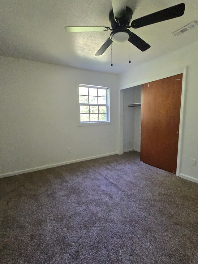 100 Pridmore St, Daleville, AL 36322 - unfurnished bedroom featuring carpet floors, baseboards, ceiling fan, and a closet