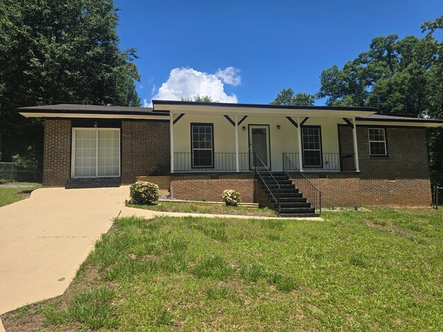 100 Pridmore St, Daleville, AL 36322 - ranch-style house featuring brick siding, a front lawn, a porch, and stairs