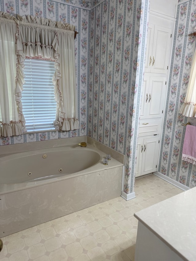 104 Wellston Ct, Dothan, AL 36305 - bathroom with tile patterned floors, a jetted tub, and vanity