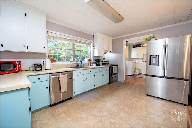 kitchen with appliances with stainless steel finishes, white cabinetry, ornamental molding, and sink