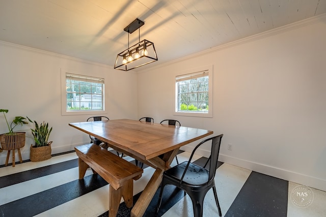 dining room with a wealth of natural light and crown molding