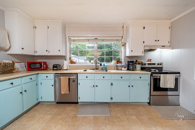 kitchen featuring blue cabinetry, sink, appliances with stainless steel finishes, white cabinets, and ornamental molding