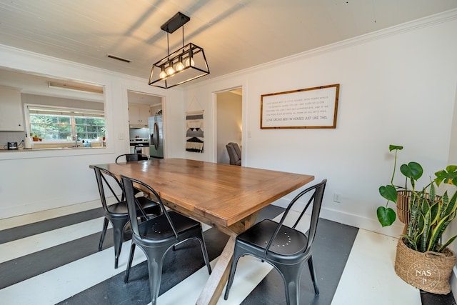 dining room with crown molding