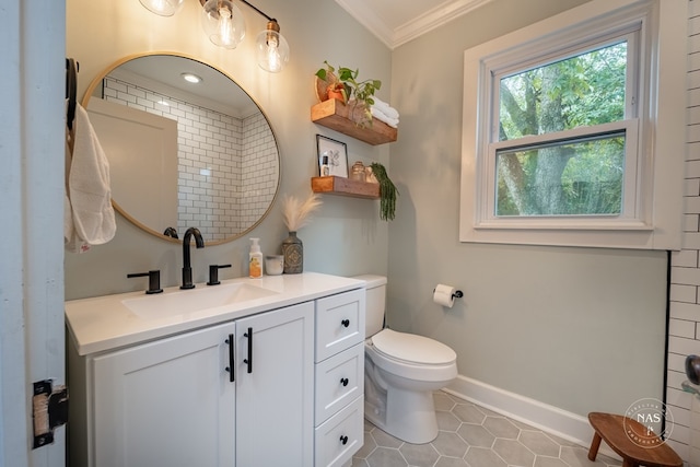 bathroom with tile patterned flooring, vanity, toilet, and ornamental molding