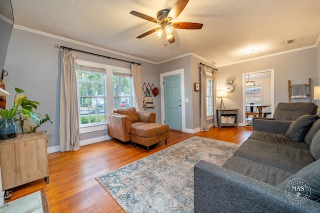 living room featuring ceiling fan, hardwood / wood-style floors, and ornamental molding